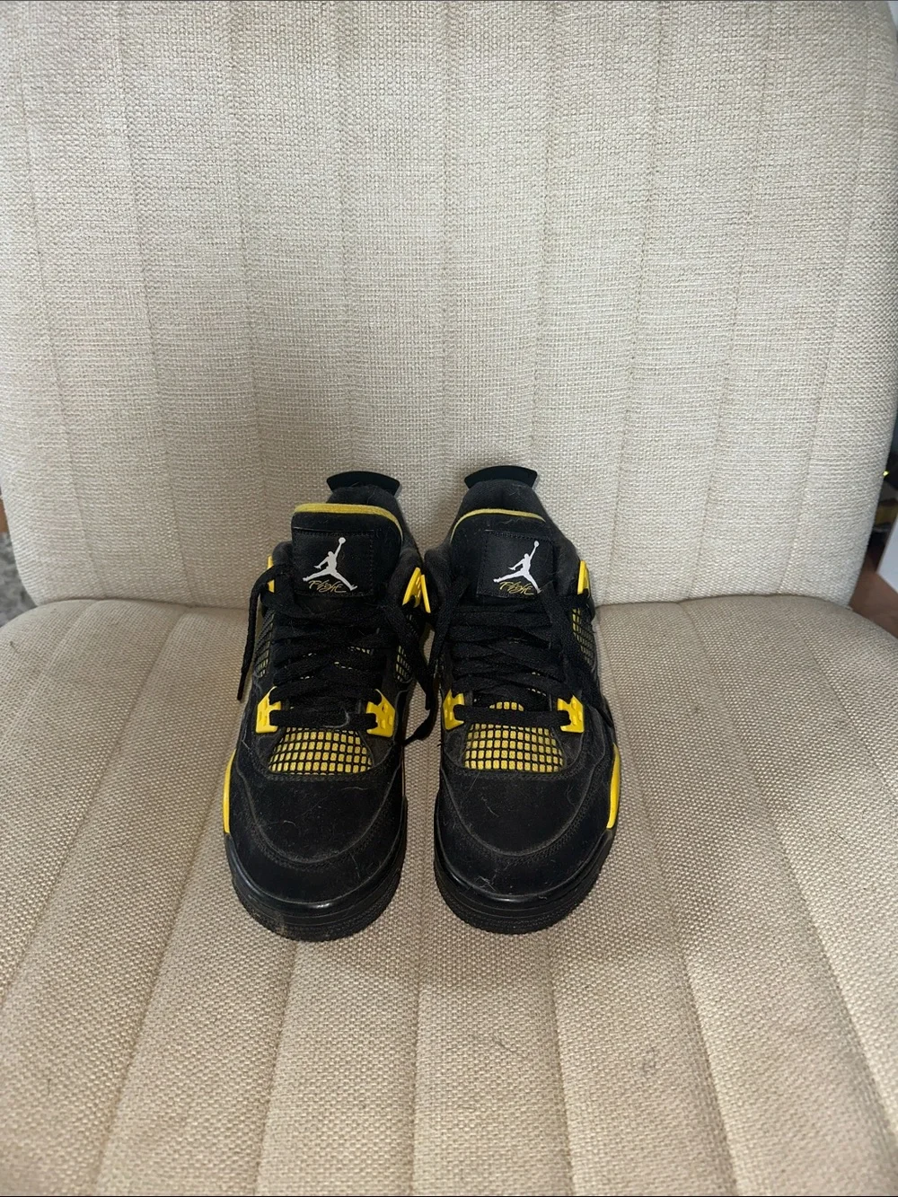 Black and Yellow Jordan 4s